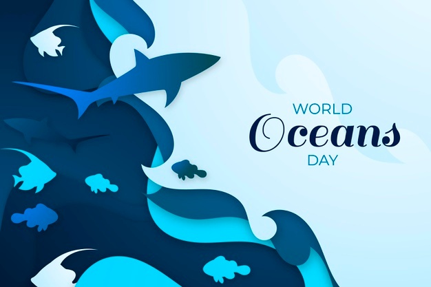 Biało niebieska kartka z napisem Światowy Dzień Oceanów